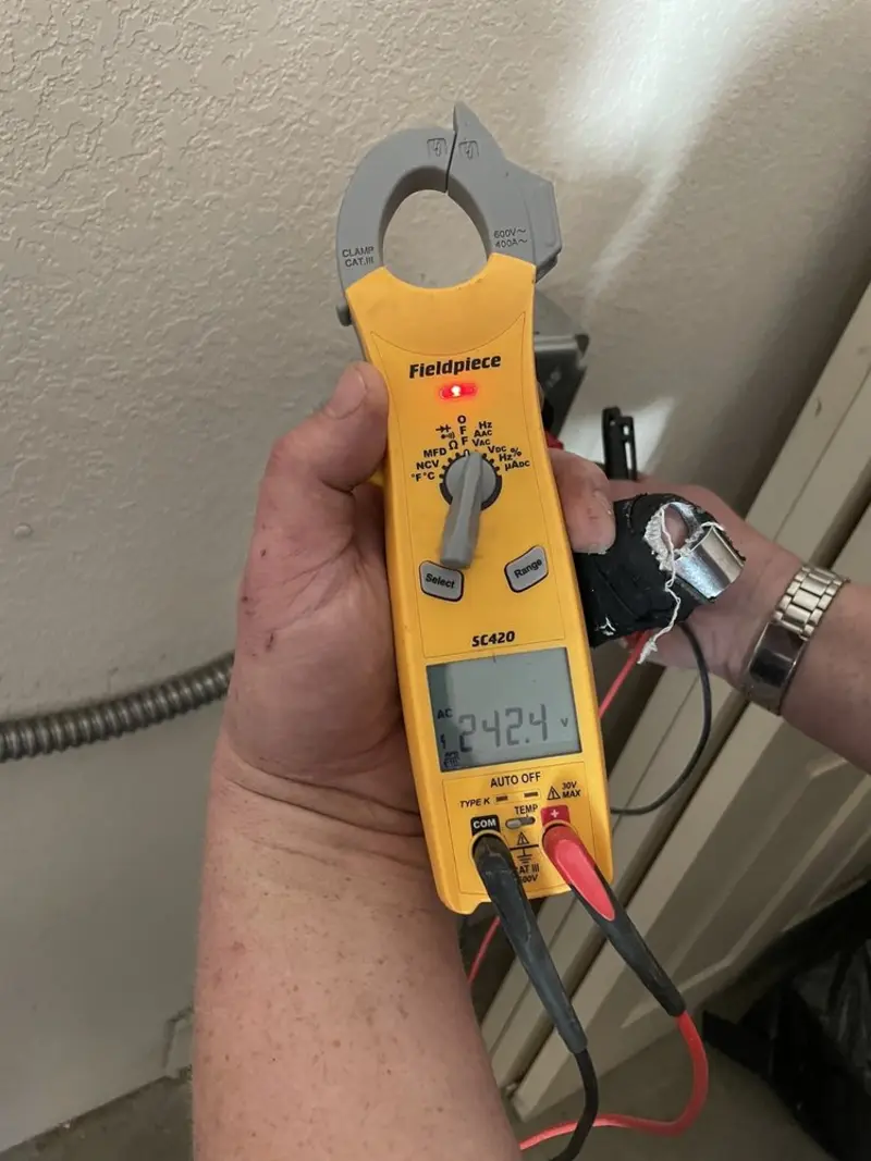 Voltage testing with clamp meter during Electrical Installation Services in Macedon